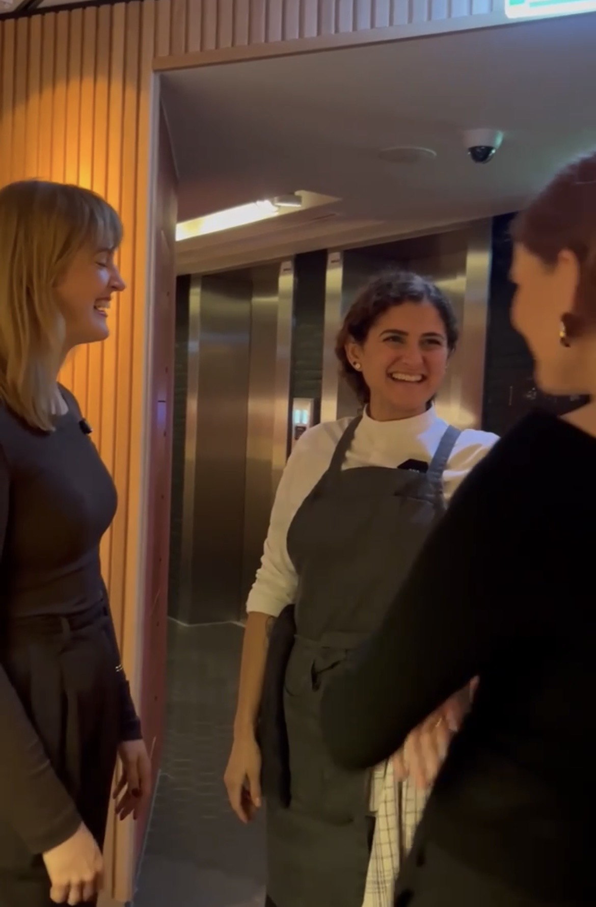Restaurant team working in an open kitchen during a Sobremesa night